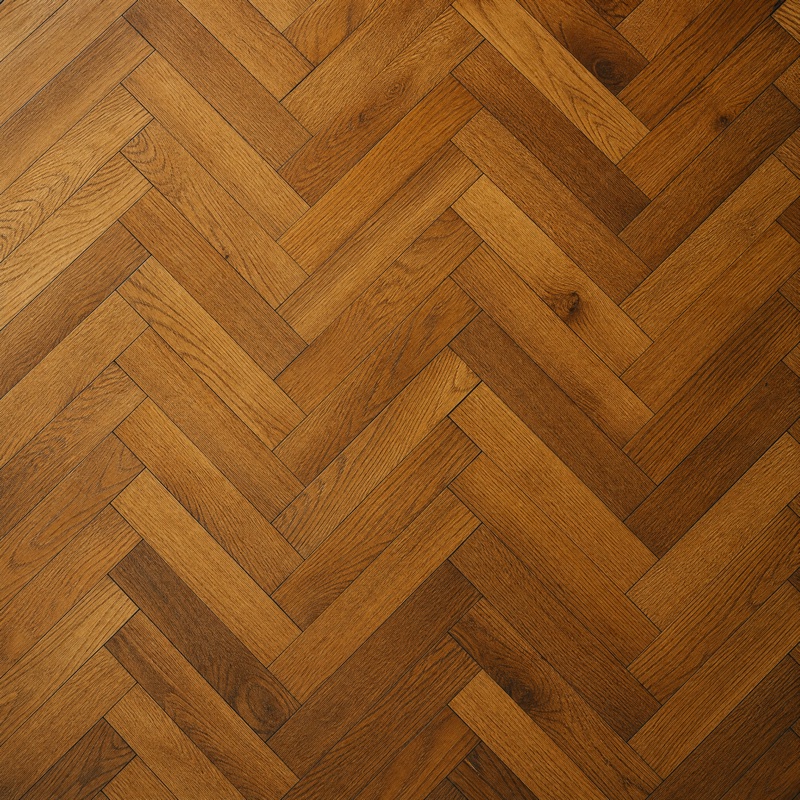 Straight-down view of honey oak blocks laid in a herringbone pattern