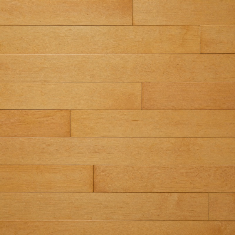 Straight-down view of smooth honey maple floorboards