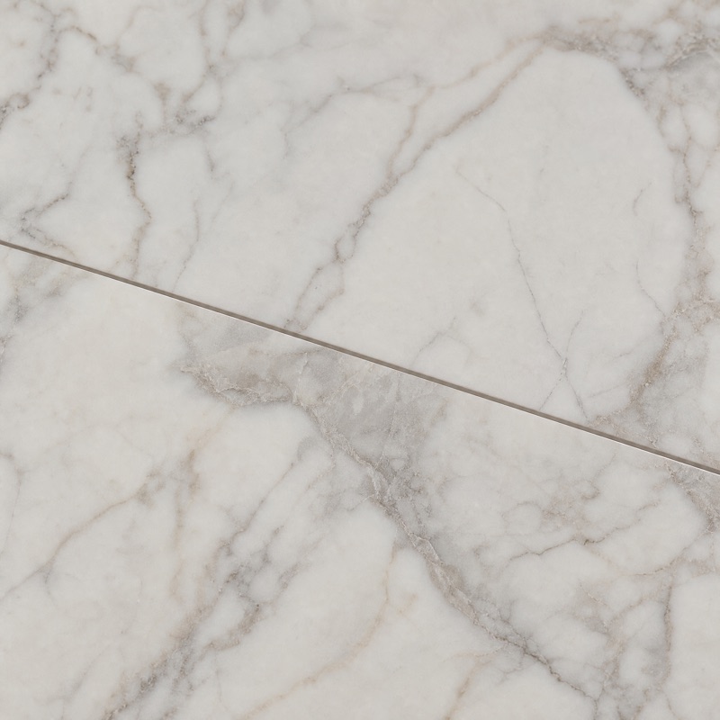Straight-down view of white and gray veined marble-look porcelain tile
