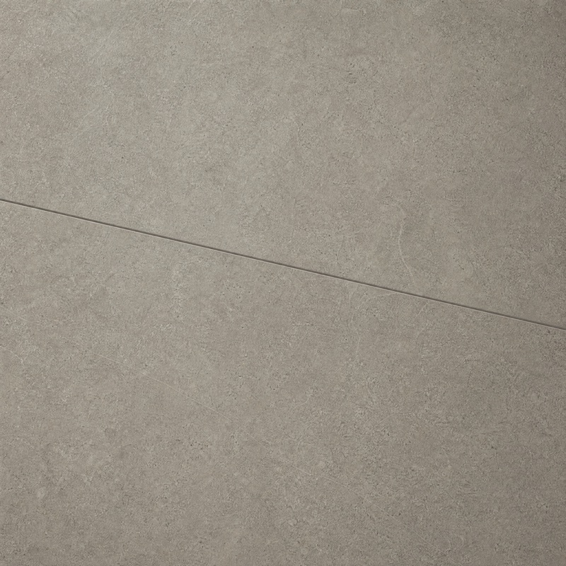 Straight-down view of large-format warm gray porcelain tile with a fine grout joint